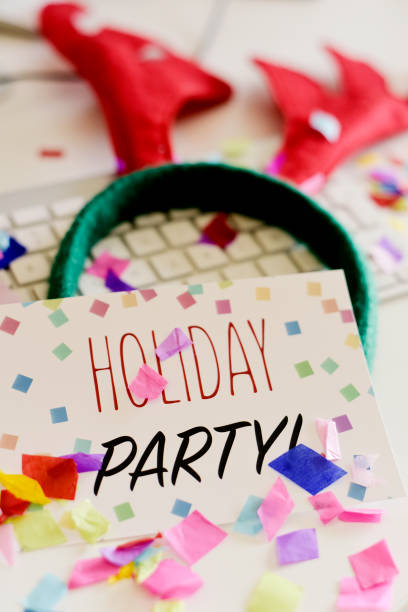 istock signboard with text holiday party on office desk 887538328