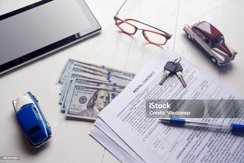 Rent contract with keys and us money on office table Rent contract with keys and us money on office table. Belgium Stock Photo