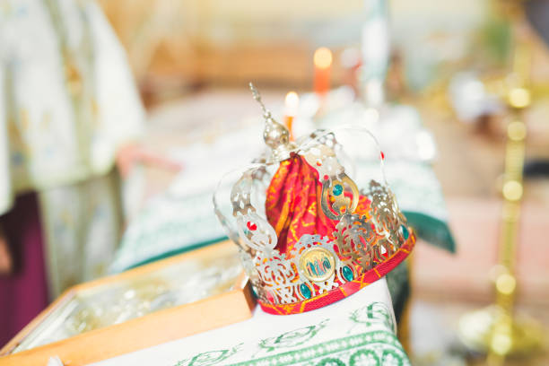 istock Golden crowns lying on the table in church 887541126