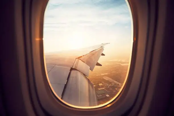 View from the window of the airplane at the sunrise. Landing in Bangkok, Thailand.