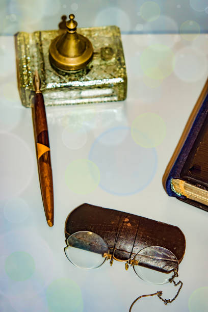istock Vintage items, glasses case, a pen, book, 887548692
