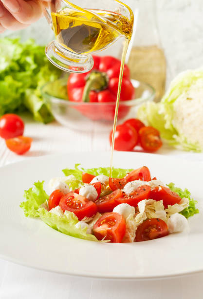 istock Vegetable salad with cherry tomatoes, mozzarella,  greens 887548848