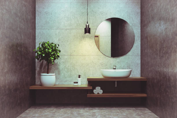istock Concrete bathroom, sink, round mirror toned 887549602