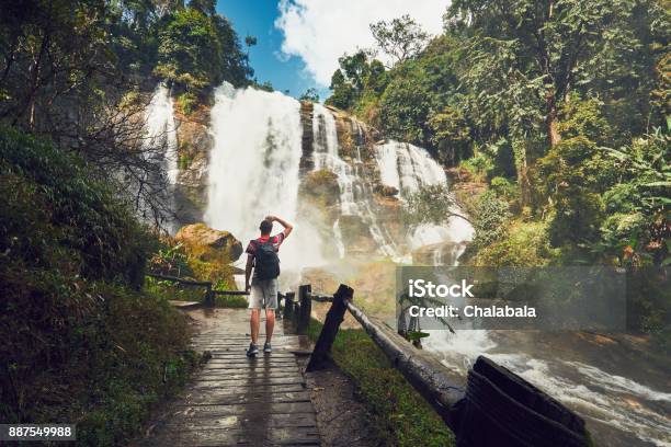 Traveler Near Waterfall Stock Photo - Download Image Now - Waterfall, Thailand, Travel