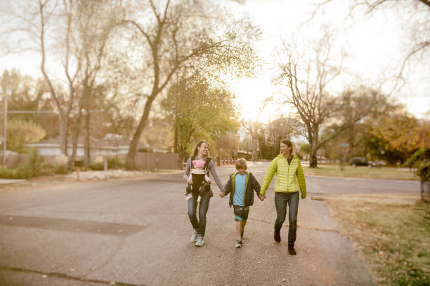 istock Two lesbian mothers spend time with their family 887554852