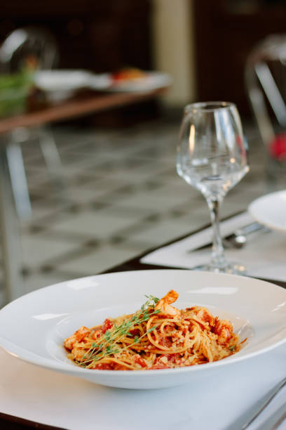 istock Beautiful spaghetti pasta at traditional italian restaurant. 887555362