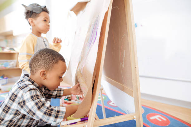 istock Adorable children with chalk creations 887557820