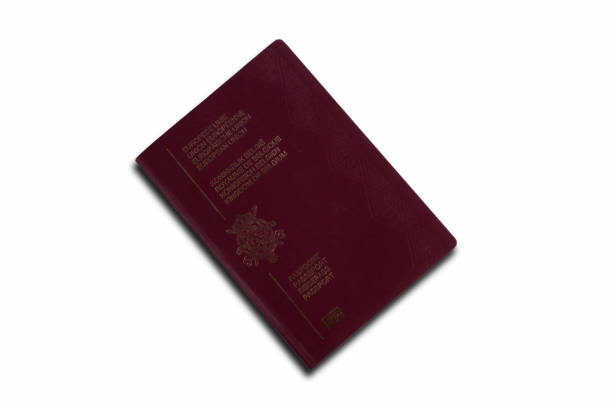 High angle view of Italian passport isolated on white background. The composition is at the right of an horizontal frame leaving a useful copy space for text and/or logo at the left. Predominant colors are red and white. XXXL 42Mp studio photo taken with SONY A7rII and Sony FE 90mm f2.8 Macro G OSS lens
