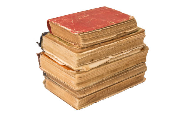 istock A stack of old tattered books. Vintage torn books. Antiques isolated. 887558428