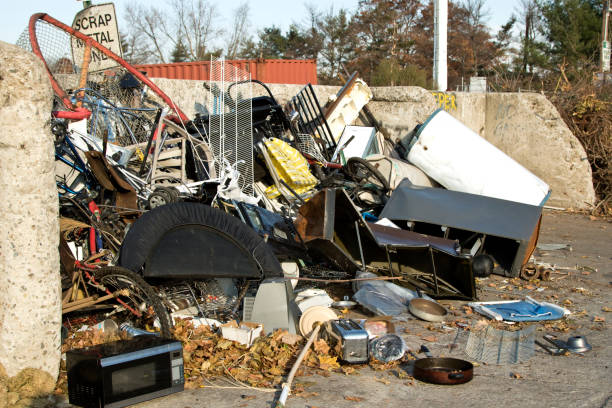 istock Recycling yard filled with mixed household junk and garbage 887568946