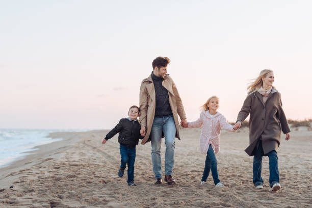 istock family holding hands 887589000
