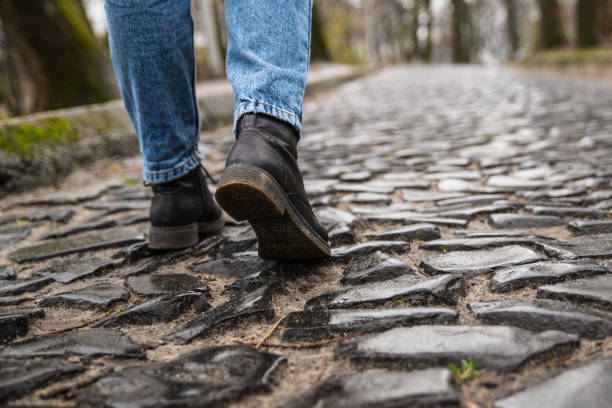 istock tourist walks on the cobbled pavement urban road 887592286