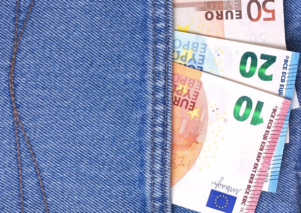 istock Euro money banknotes in blue jeans pocket. 887596758