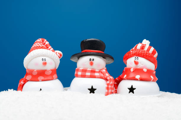 istock Three snowman in the snow 887596928