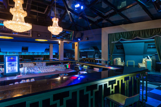 istock Chandeliers skylight and empty bar counter in restaurant interior 887597526