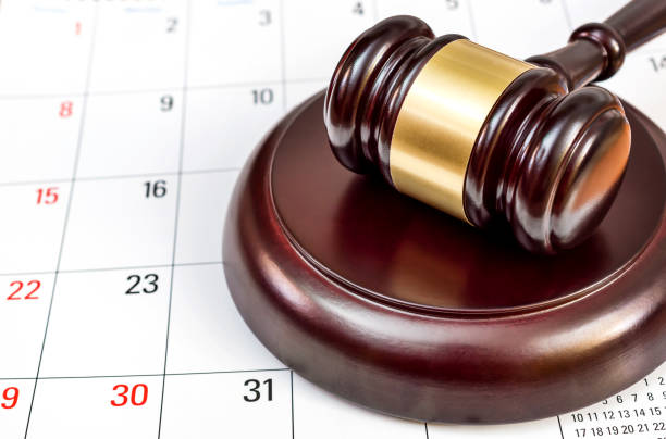 istock Judge's gavel on the calendar. 887597802