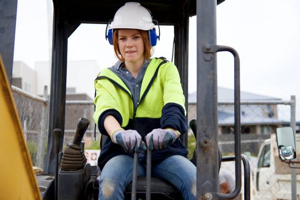istock SYD112017 Female construction worker driving bulldozer 887597808