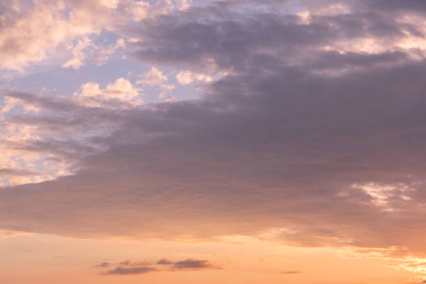 istock purple and orange clouds during sunset 887605768