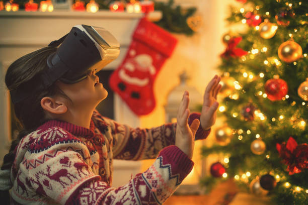istock Little Girl Using Virtual Reality Simulator on Christmas 887605824