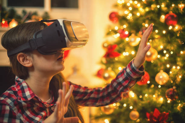 istock Teenage Girl Using Virtual Reality Simulator on Christmas 887606724
