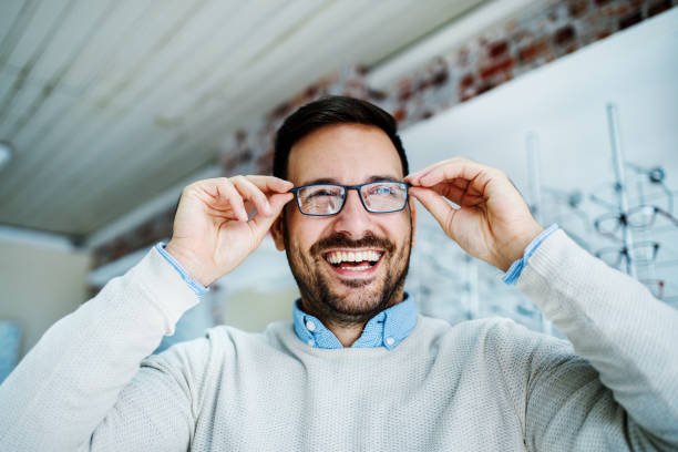 Man in optics store stock photo