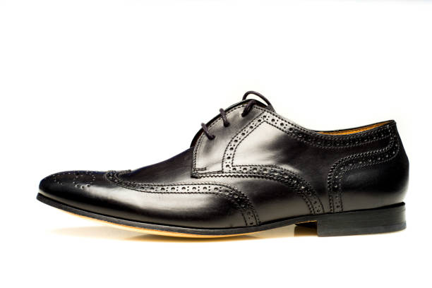 istock Black leather men's shoe isolated on white background 887620372