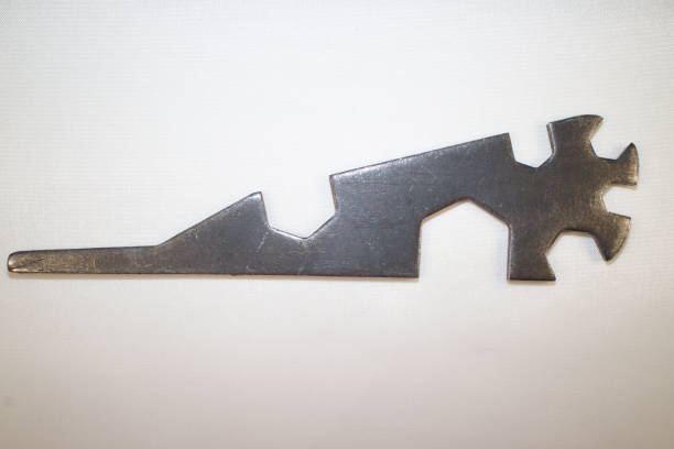 tool for work, a metal key for bolts and nuts with a screwdriver