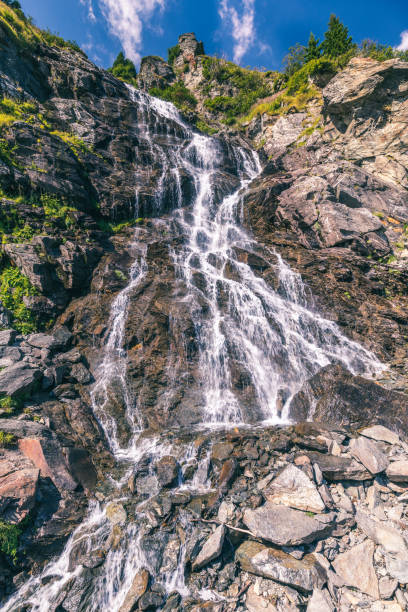 istock Capra waterfall in Fagaras mountains, Romania 887626382