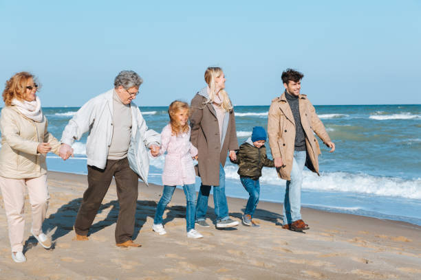 istock multigenerational family holding hands 887632296