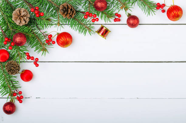 istock Christmas wooden background with Christmas tree branches and Xmas decorations. 887632468