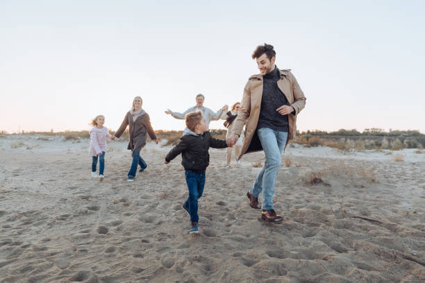 istock multigenerational family on seashore 887632516