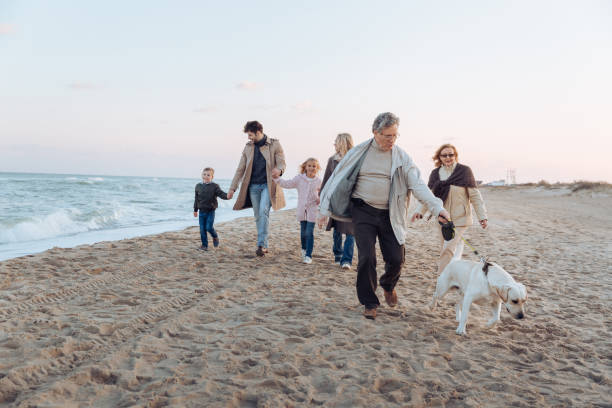 istock multigenerational family walking with dog 887635578
