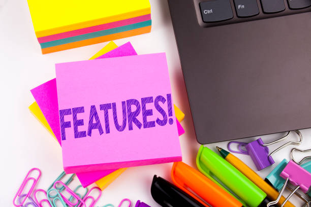 istock Writing text showing Features made in the office with surroundings such as laptop, marker, pen. Business concept for Advertisement Advertising Workshop white background copy space 887640802
