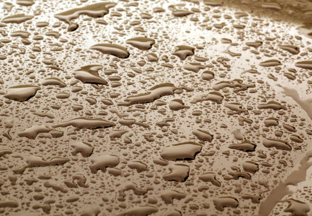 istock Water drops on brown color metal surface with blur effect. 887641412
