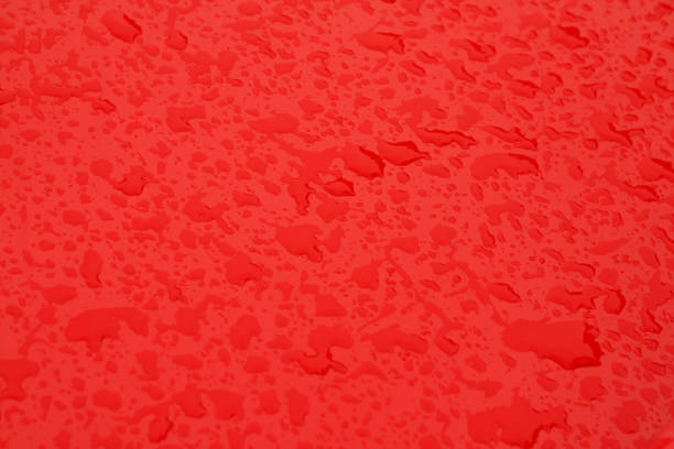 istock Water drops on metal surface in red color. 887641612