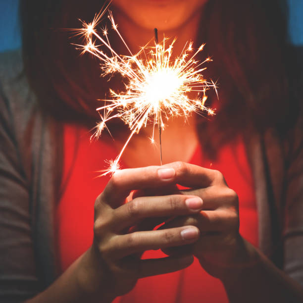 istock Asian Woman with sparkler. 887641818