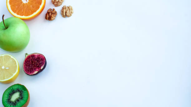 istock Background of fresh sliced fruit on a table in the afterno 887646348