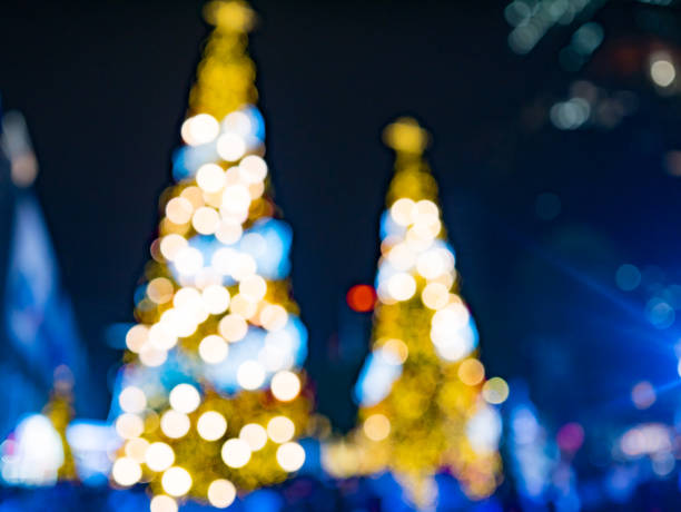 istock blur image of artificial pine christmas tree , bokeh of LED decorative light defocused background and textured,  for Christmas Eve , New Year party holiday and celebration background 887646604