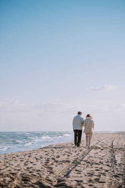 istock senior couple on seashore 887646692