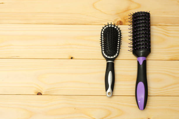 istock combs for hair on wooden background 887646894
