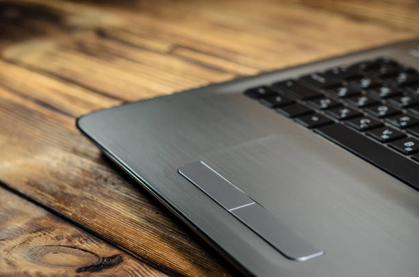 istock Laptop on wooden table 887646938