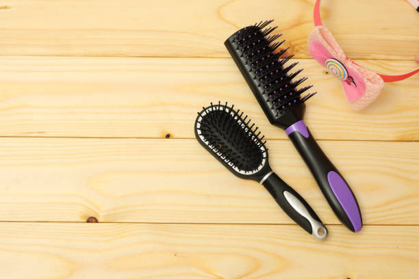 istock combs for hair on wooden background 887646952