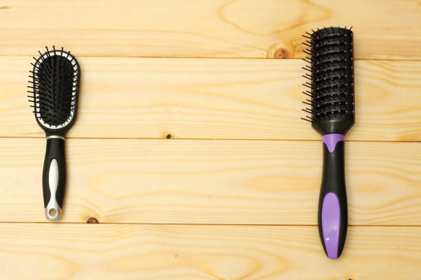 istock combs for hair on wooden background 887646956