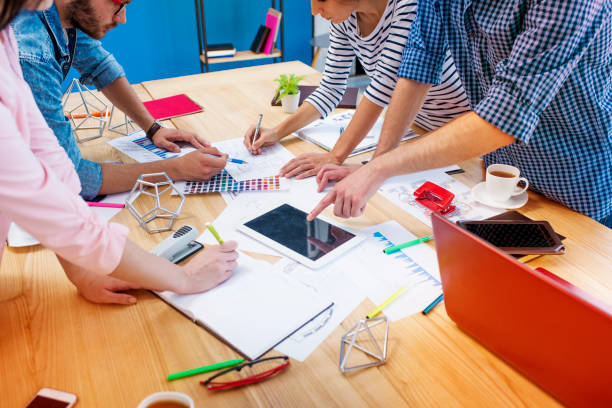 istock Hands of young business and confident people at work on the project 887647656