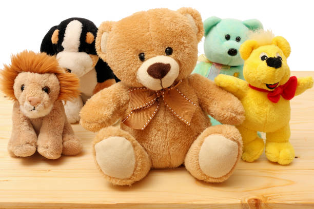 toy teddy on wood background