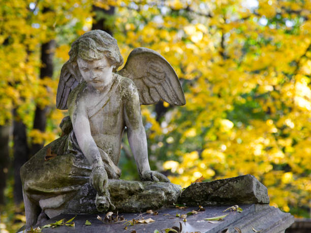 istock Angel statue at cementery. Relogious symbol, copy space 887648156