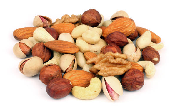 istock mix almonds, cashew nuts, hazelnut, peanuts, walnuts, pistachio isolated on white background 887652016