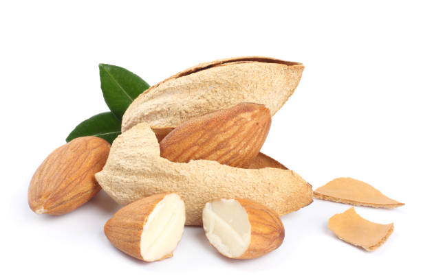 istock almond with green leaf isolated on white background 887652096