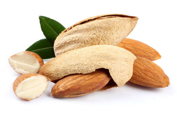 almond with green leaf isolated on white background