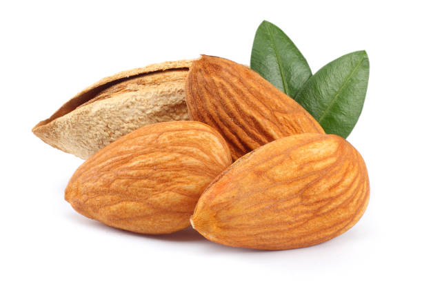 istock almond with green leaf isolated on white background 887653028